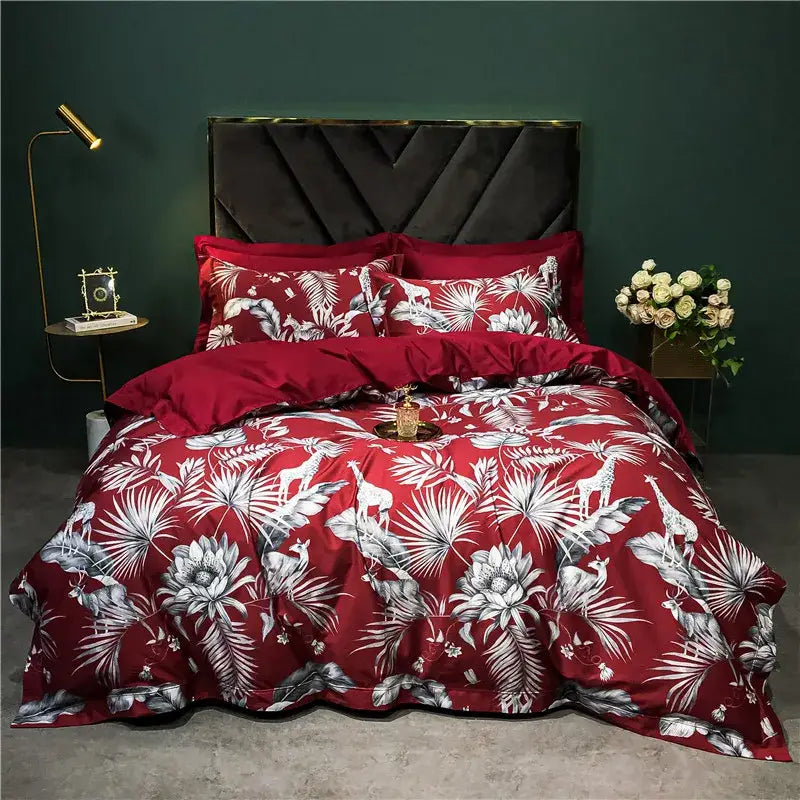 Red tropical-themed duvet set with white and gray botanical prints featuring giraffes and deer in a decorbites 1400tc egyptian cotton bedding set