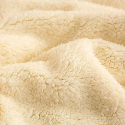 Cream-colored plush fleece fabric of the sage green and cream cozy warmth velvet autumn sleep blanket for bedroom decorbites cozy warmth