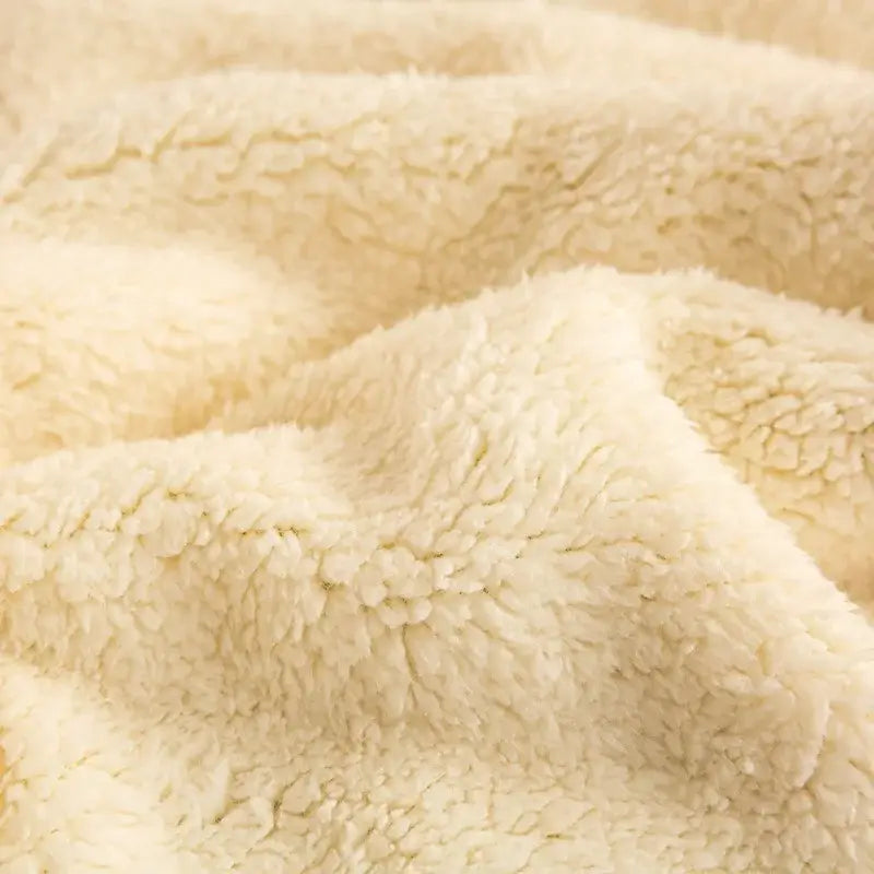 Cream-colored plush fleece fabric of the sage green and cream cozy warmth velvet autumn sleep blanket for bedroom decorbites cozy warmth