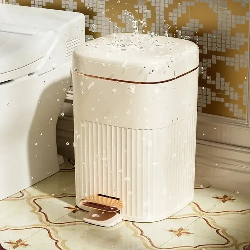 Cream-colored rectangular pedal trash can with vertical ridges and rose gold trim decorbites light luxury kitchen bin