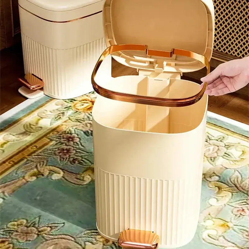 Cream-colored ribbed plastic pedal trash can with rose gold accents from decorbites light luxury kitchen bin collection