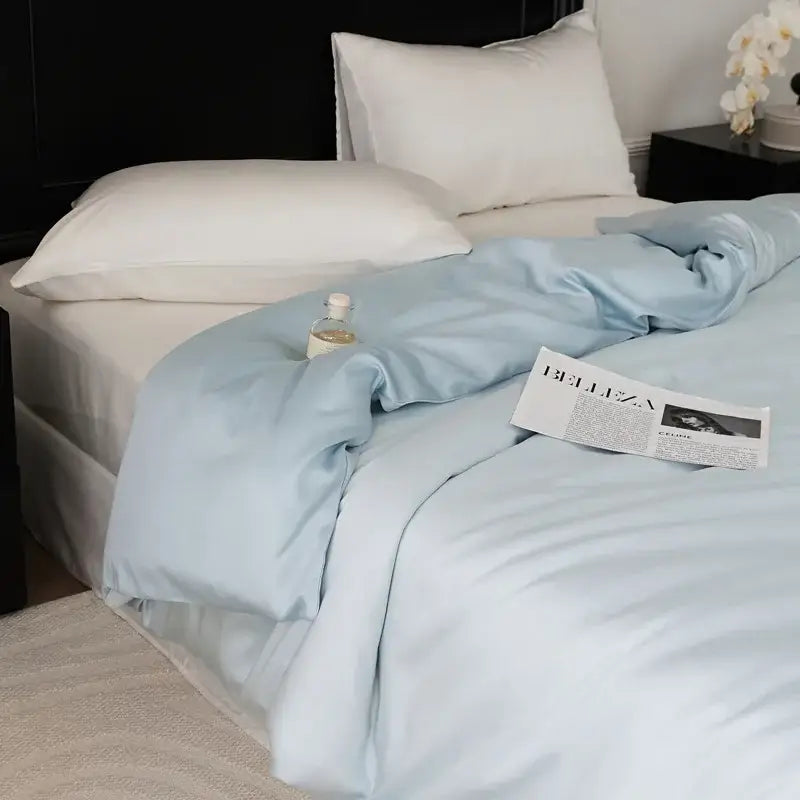 Light blue satin duvet set with smooth glossy finish part of sage green double layer satin queen bedding collection