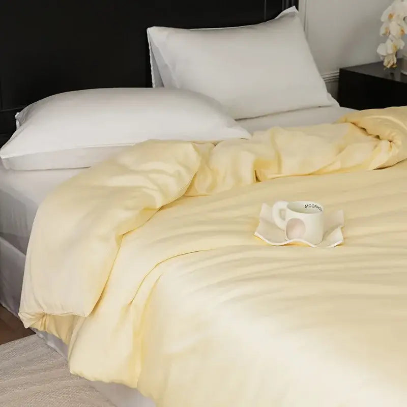 Soft pale yellow quilted comforter with subtle stitching in sage green double layer satin queen duvet set bedroom bedding