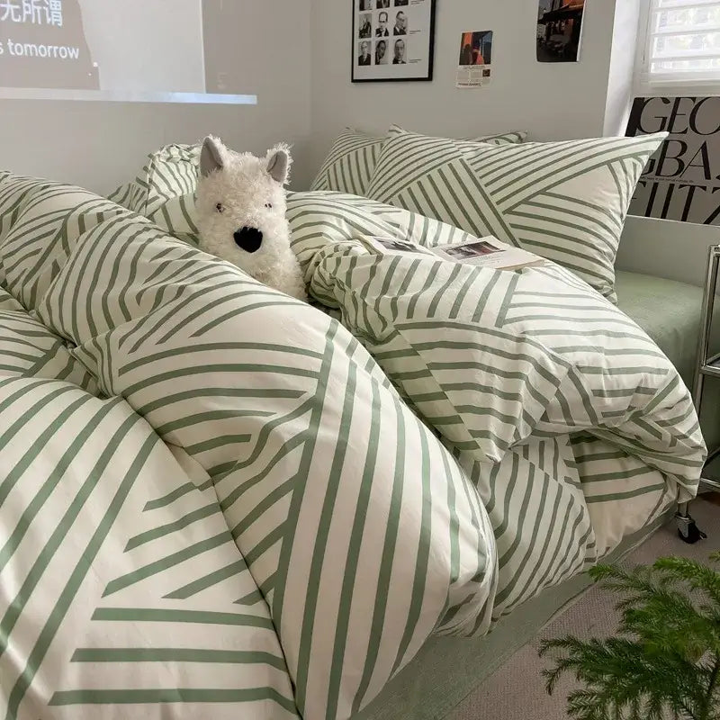 A cozy sage green grid print cotton bedding set with cream base and bold diagonal stripes for elegant bedroom decor