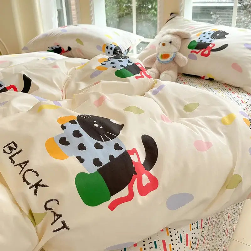 Cream-colored duvet cover with playful black cat print in vibrant hues, part of sage green decorbites grid print cotton bedding set