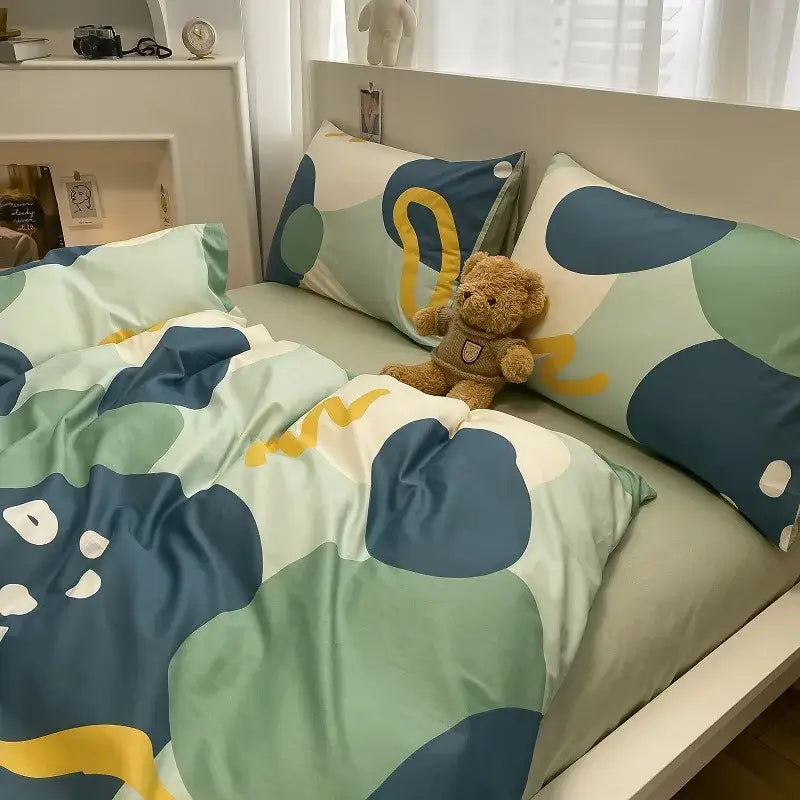 Sage green grid print cotton bedding set with pastel green and navy blue abstract pattern and yellow accents for bedroom