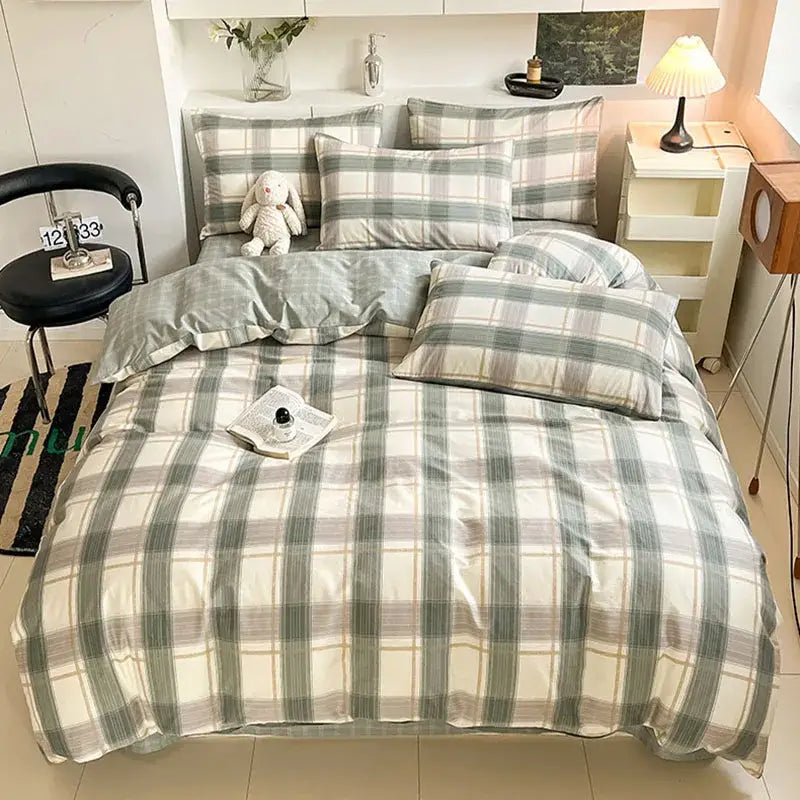 Sage green grid print cotton bedding set featuring plaid duvet and matching pillows with subtle sheen décorbites grid print