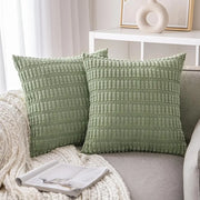 Two sage green ribbed corduroy throw pillow covers with textured fabric for living room decor
