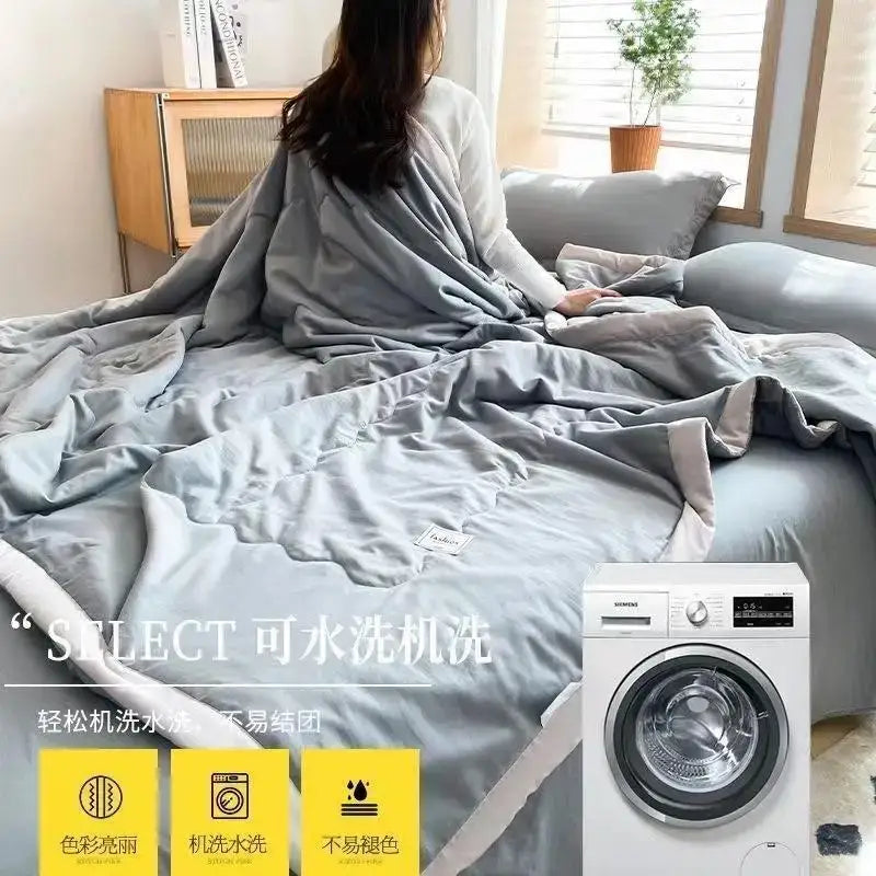 Gray quilted comforter with subtle woven texture and plush appearance made from decorbites cooling cotton quilt material