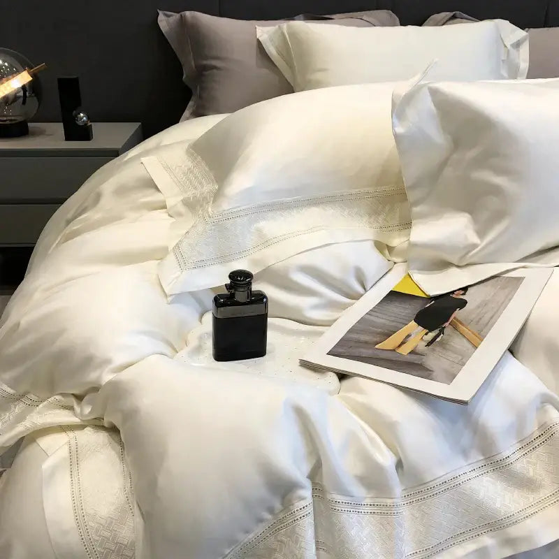 Cream-colored satin bedding set with delicate embroidered trim made from decorbites 1000tc lyocell fibre material
