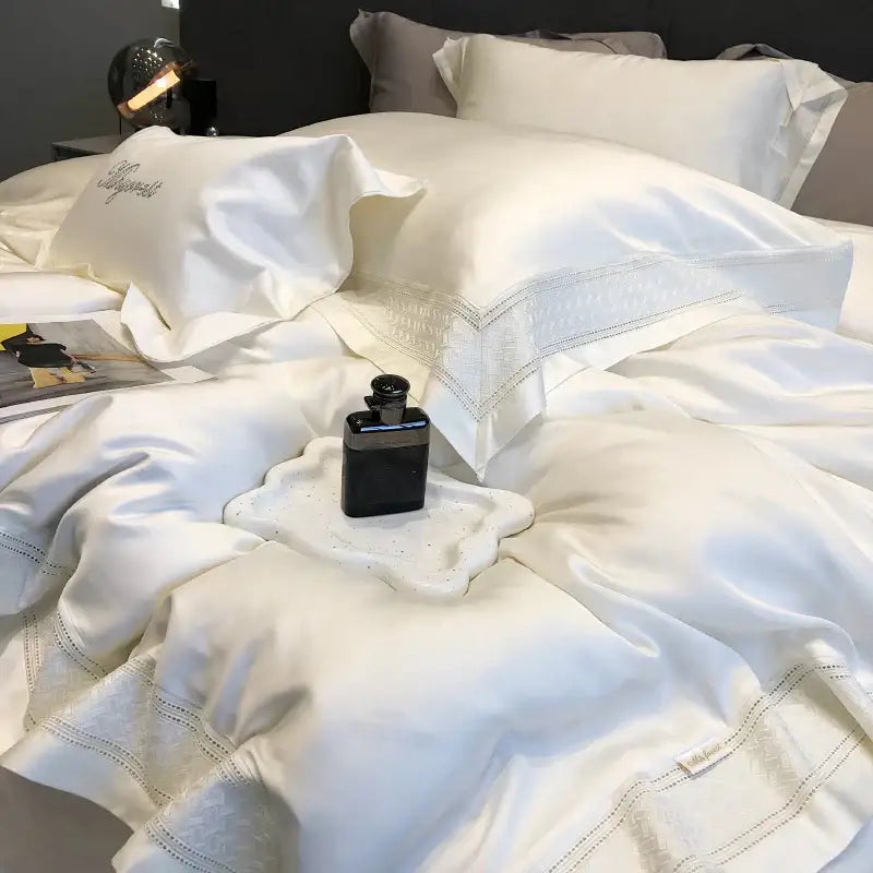 Luxurious white satin bedding set with elegant embroidery and subtle sheen made from decorbites 1000tc lyocell fibre