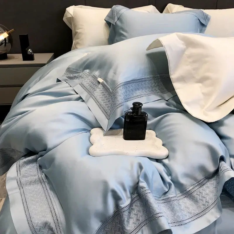 Light blue satin bedding set with subtle gray geometric embroidery made of decorbites 1000tc lyocell fibre