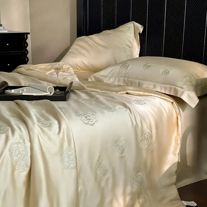Cream-colored satin quilt set with delicate silver eucalyptus fiber flower embroidery for bedroom decorbites collection