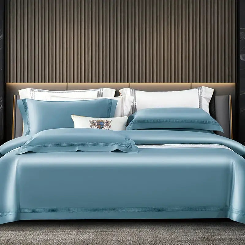 Luxurious light blue satin duvet cover set with elegant embroidery coordinating pillow ensemble for bedroom bedding