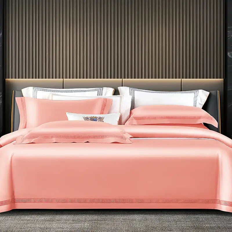Pink satin duvet cover set with embroidered trim and matching pillowcases in satin cream and gold egyptian cotton bedding