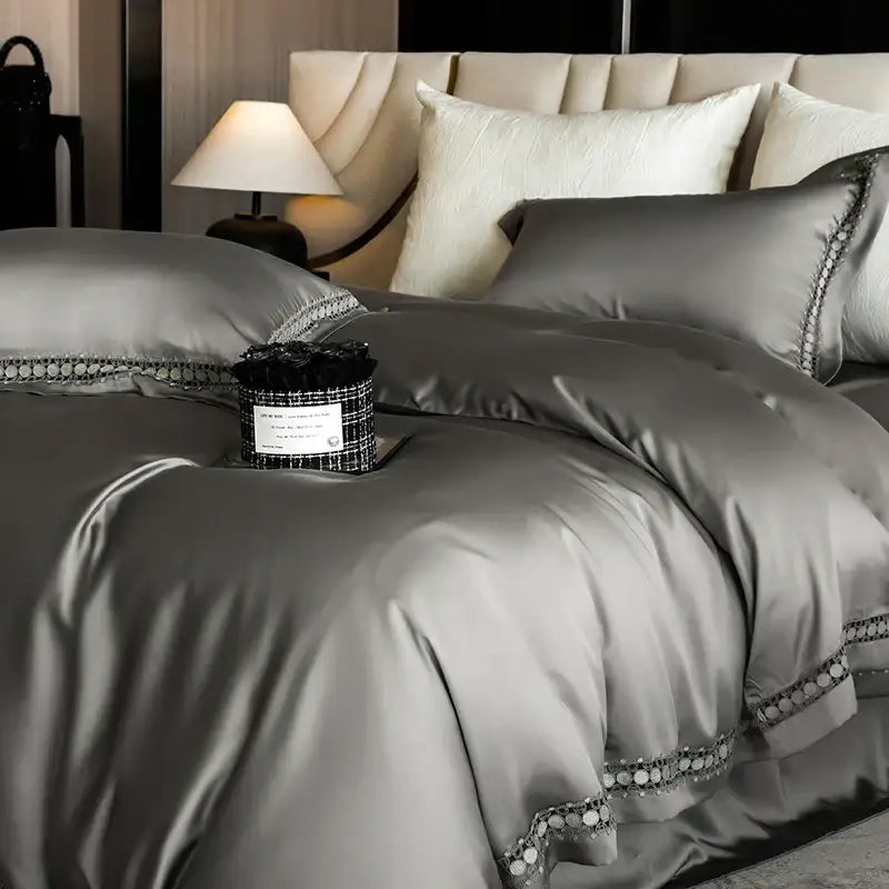 Silver satin duvet cover set with elegant beaded trim complementing cream and gold lace eucalyptus bedding