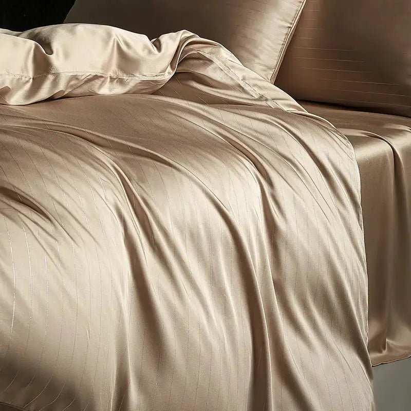 Beige satin duvet cover with subtle vertical ribbing in a dark gray and silver pinstripe bedding set
