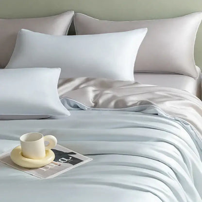 Light blue satin bedding set with solid color duvet cover and matching pillowcases featuring decorbites cool touch