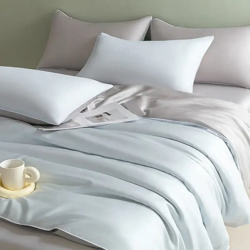 Light blue satin bedding set with solid color design and soft luxurious texture for decorbites cool touch comfort