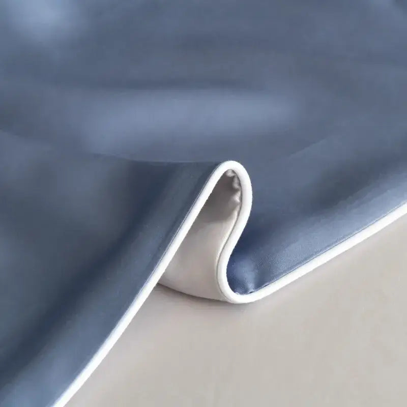 Blue satin fabric bedding set with solid color and crisp white stitched edge for decorbites cool touch duvet cover
