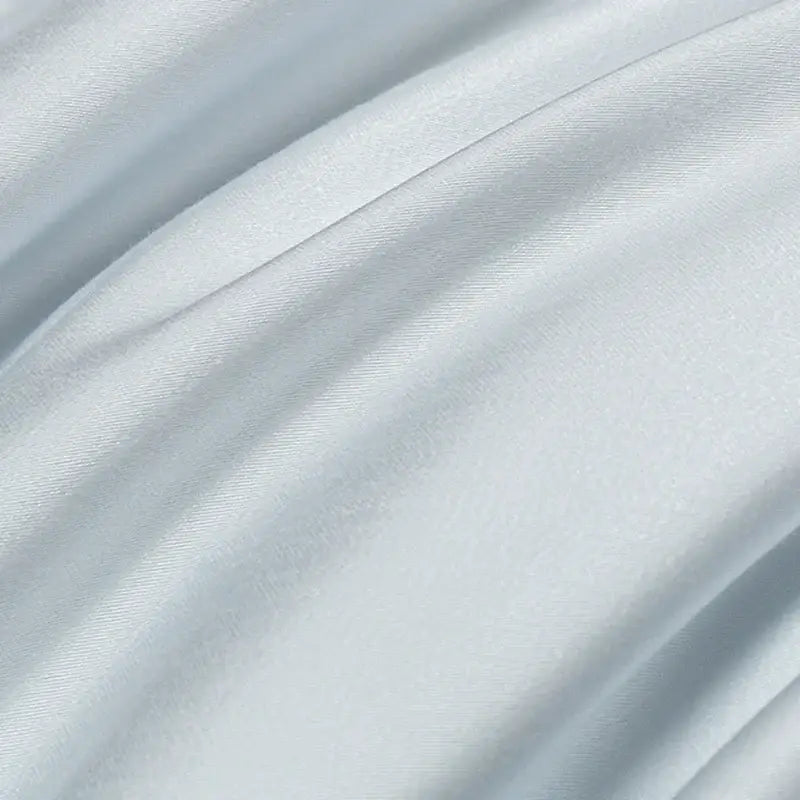 Soft pale blue satin bedding set with solid color design and decorbites cool touch for smooth glossy finish