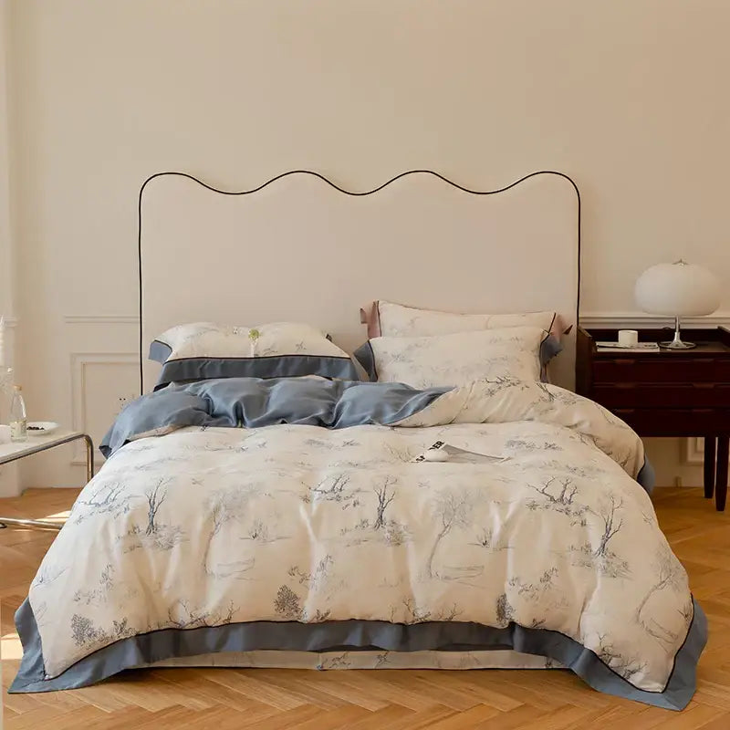 Cream-colored cream cotton bedding set with gray botanical prints and soft blue satin trim in egyptian cotton bedding