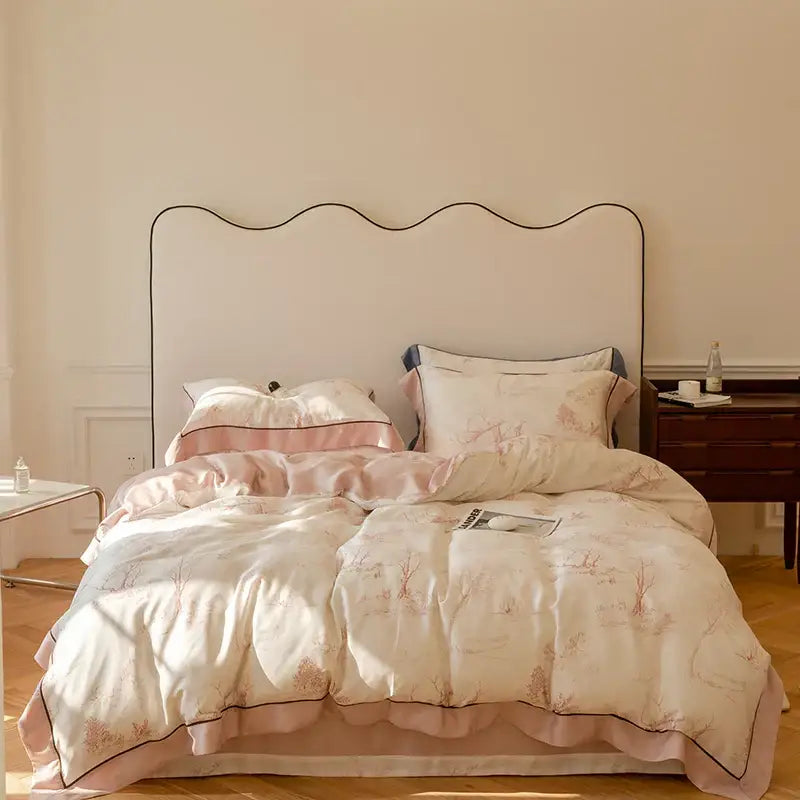A blush pink and cream satin duvet set with floral embroidery in a cotton bedding set for bedroom use