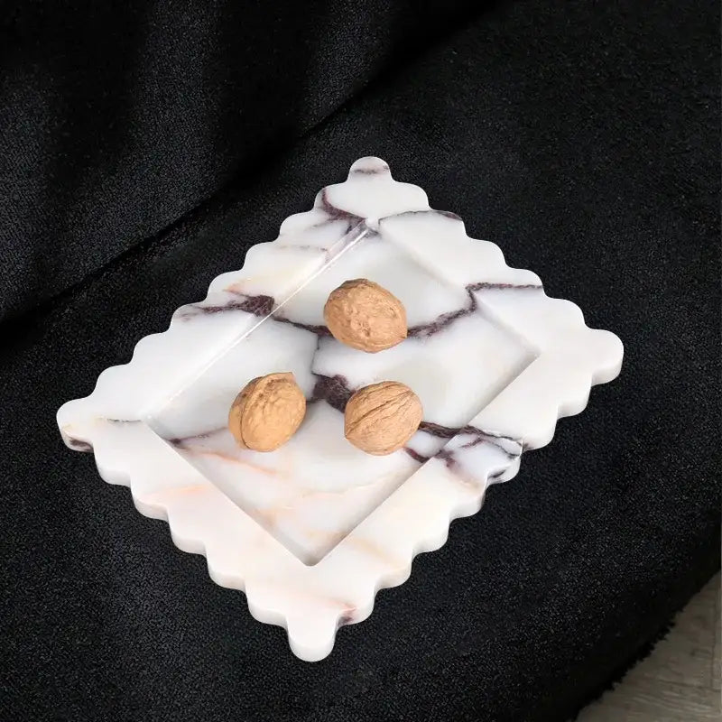 White and gray scalloped calacatta viola marble tray featuring a marbled walnut holder for kitchen luxury decor