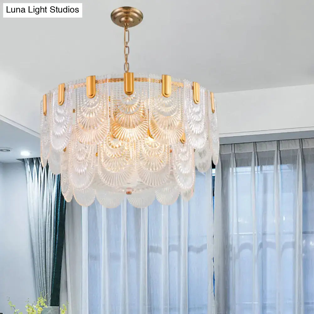 Elegant gold-toned DecorBites scalloped clear textured glass drop lamp with layered fan-shaped shades for dining room