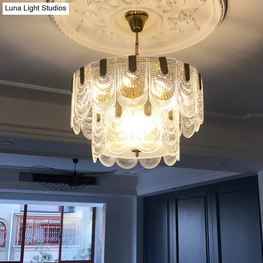 Elegant DecorBites scalloped clear textured glass drop lamp with gold-toned brass accents for classic dining rooms