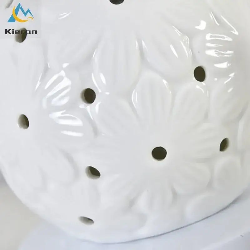 Scalloped cream ceramic led desk lamp with raised floral pattern and circular holes for bedroom decorbites ceramic led use