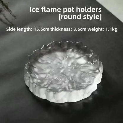 Round translucent ice-blue resin pot holder with flame-like texture used as crystal glass coaster and jewelry display panel