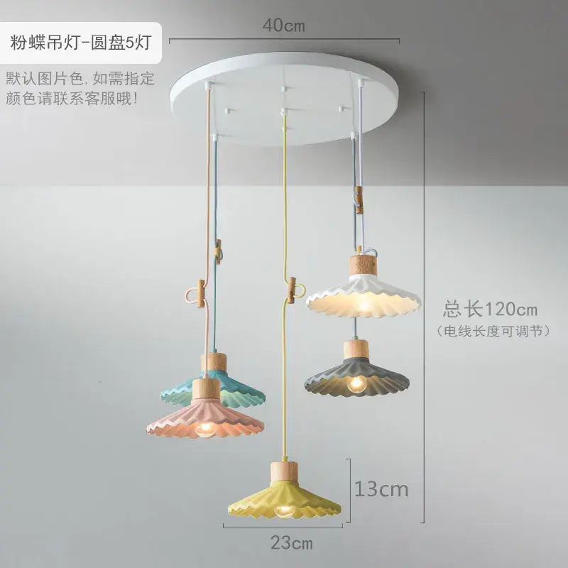 Scalloped pastel butterfly-shaped led pendant lights with wooden accents and adjustable cords for dining room use
