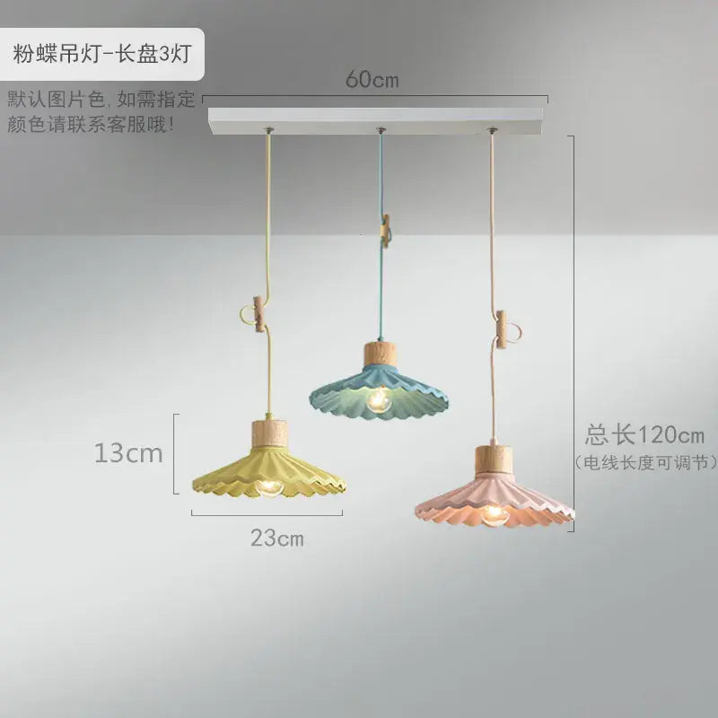 Scalloped pastel led pendant lights shaped like butterflies with wooden accents and adjustable cords for dining room use