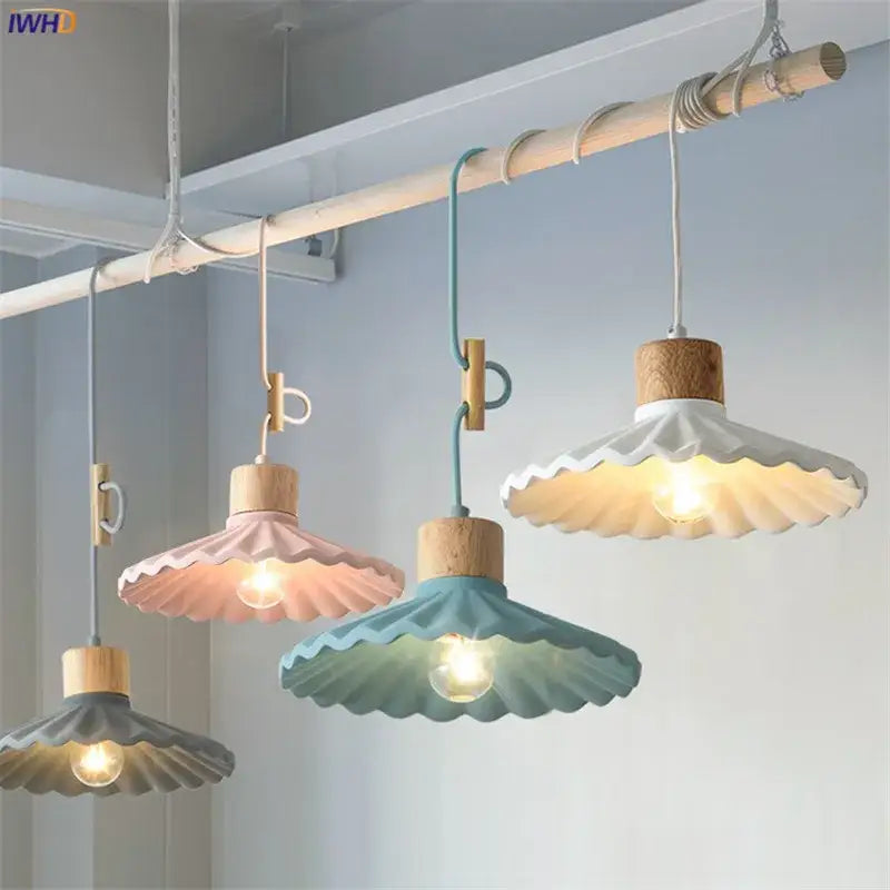 Scalloped pastel led pendant lights with wooden tops and fabric shades in pink teal and gray for dining room