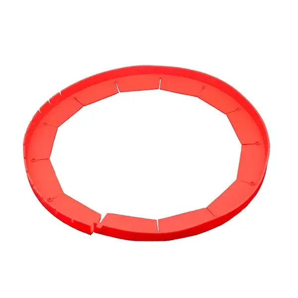 Red plastic circular pie crust shield with scalloped segmented sections for protecting pie crust edges during baking