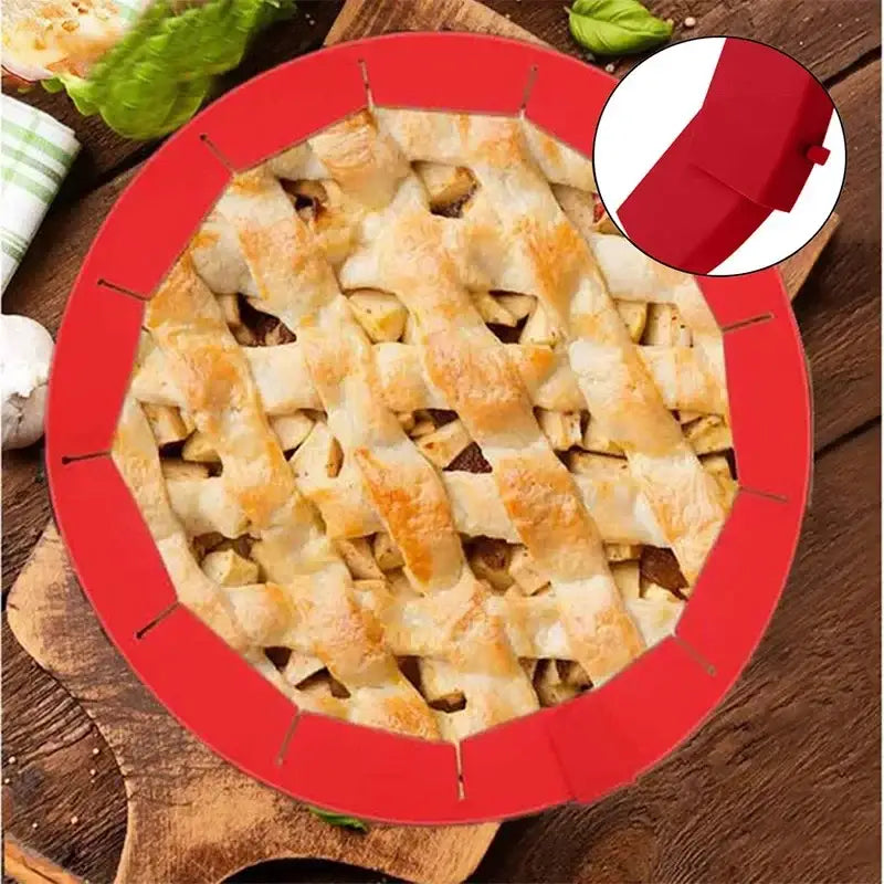 Scalloped red silicone pie crust shield with flexible heat-resistant design for easy removal of baked pie crusts