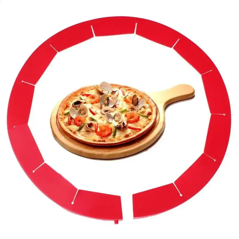 A vibrant red scalloped silicone pie crust shield with segmented circular design holding a seafood pizza on a wooden board