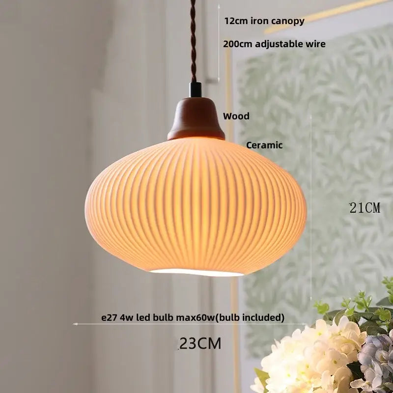Warm-toned scalloped white ceramic led pendant lamp with vertical ridges, wooden canopy, and iron wire suspension by decorbites ceramic led