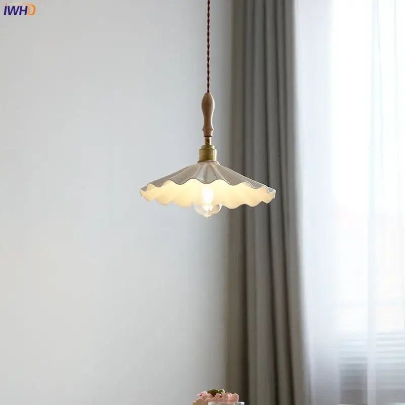 A cream scalloped ceramic led pendant light with wooden finial and brass hardware for bedroom decorbites ceramic led