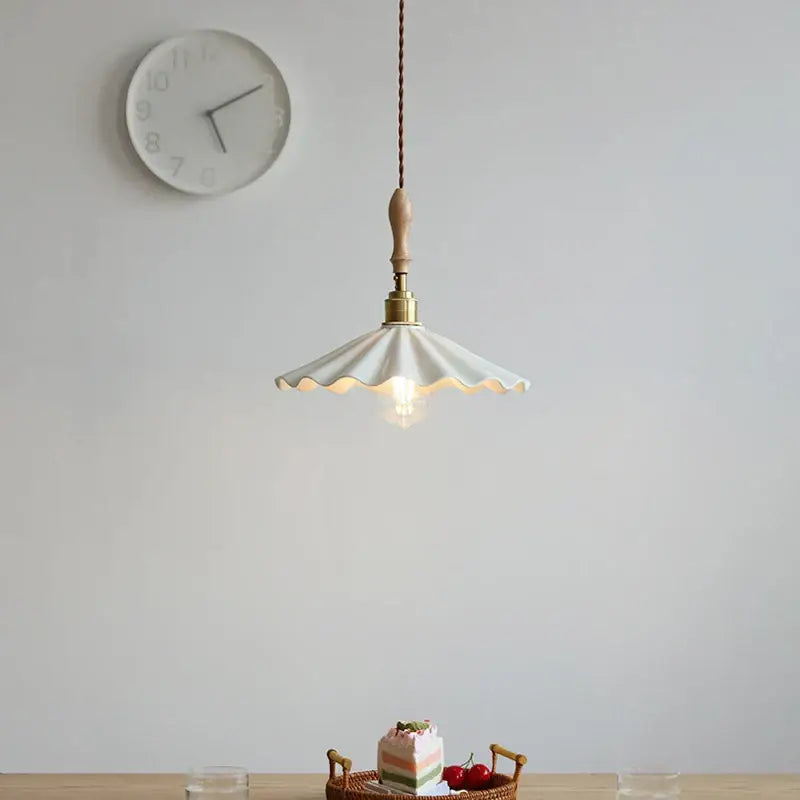 White scalloped ceramic led pendant light with wooden handle and brass accents from decorbites ceramic led pendant collection
