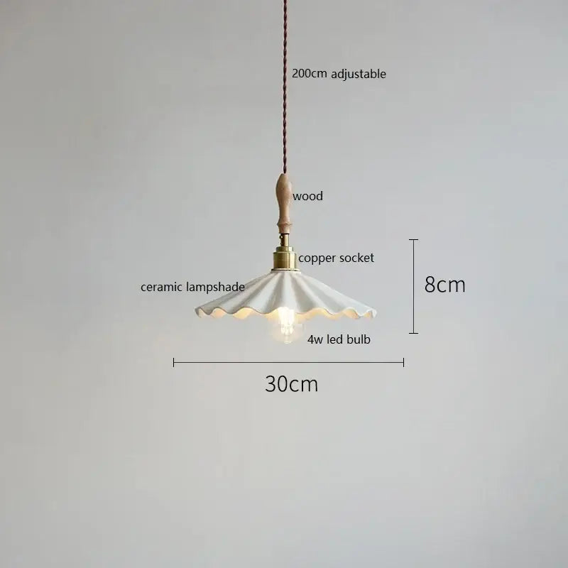 Scalloped white ceramic led pendant light with fluted design hanging from wooden handle and copper socket by decorbites ceramic led