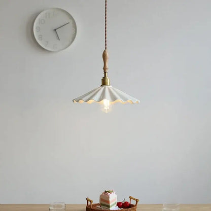 Off-white scalloped white ceramic led pendant light with brass fixture and braided cord for dining room decorbites ceramic led