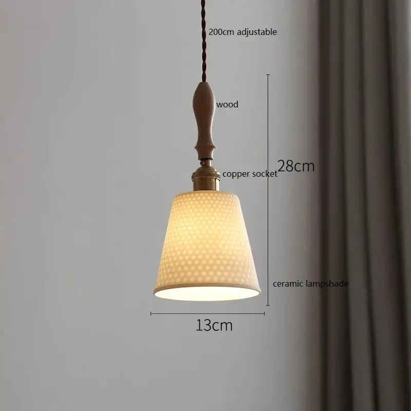 A warm-toned scalloped white ceramic led pendant light with honeycomb texture hanging from wooden handle for dining room decorbites ceramic led pendant