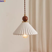 Scalloped white ceramic wood pendant lamp with fluted shade and brown wooden sphere accent for dining room decorbites ceramic wood led