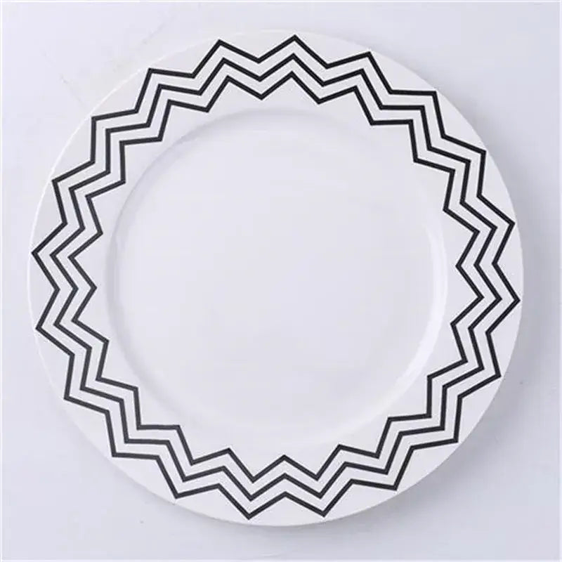 White ceramic dessert plate with bold black zigzag rim pattern from decorbites ceramic dessert plates collection
