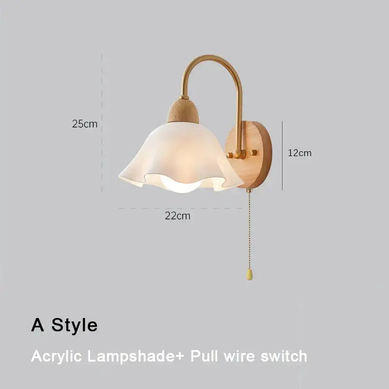 A warm-toned Scandinavian brass and cream led wooden wall lamp with curved arm and acrylic shade for bedroom decorbites cream led