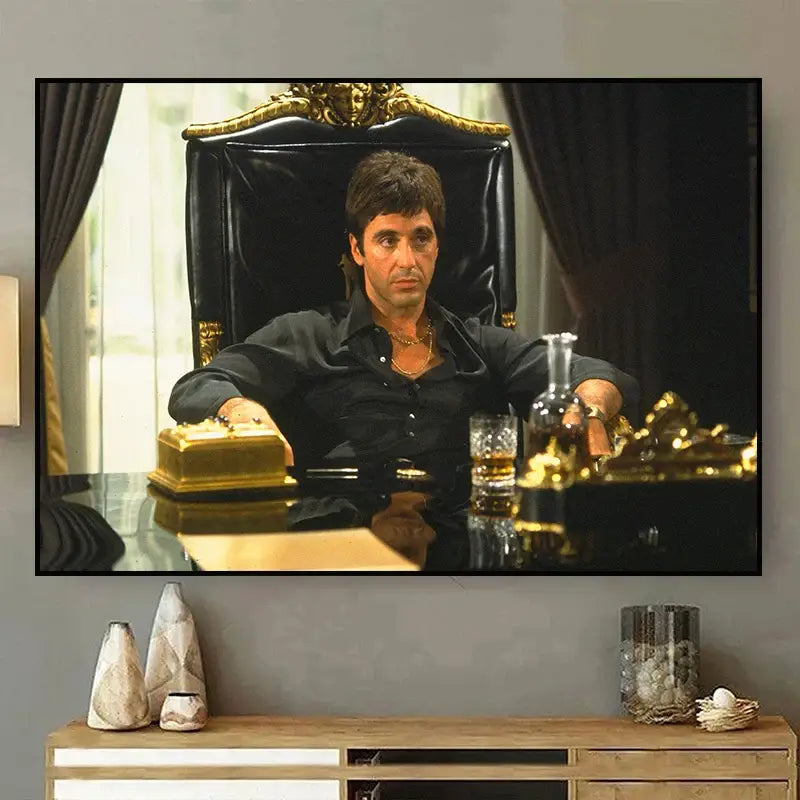 Black leather chair with gold ornate detailing complementing tony montana canvas wall art by decorbites