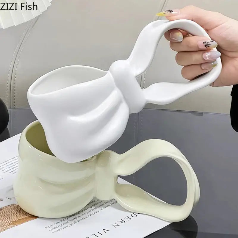 White ceramic decorbites bowknot ceramic coffee mug with sculpted bow handle for kitchen tea cup use