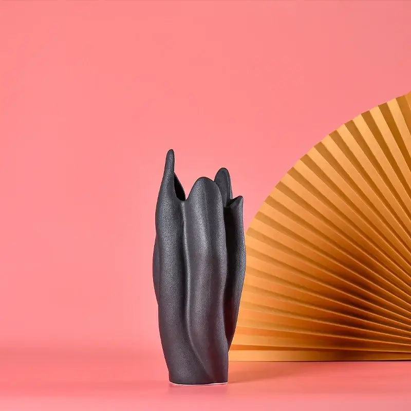 Black texture ceramic vase with sculpted leaf-like ridges ideal for living room decor by decorbites black texture